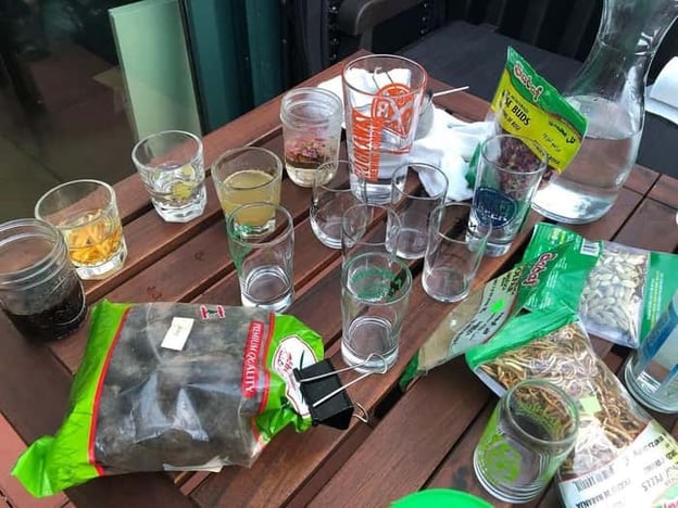 Overhead shot of beer glasses and various ingredients from Back Home Beer