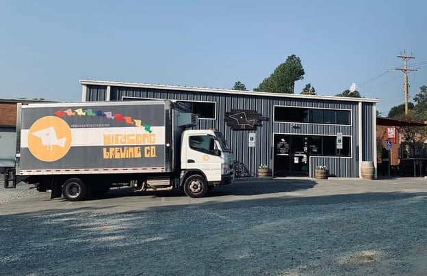 Exterior of Birdsong Brewing with delivery truck outside