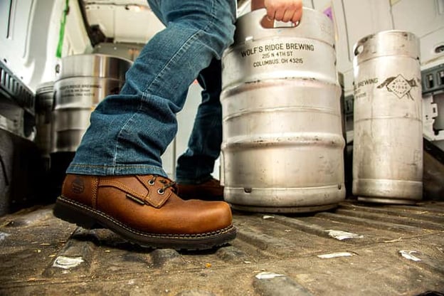 Close up of Georgia Boot while brewer is loading kegs into truck