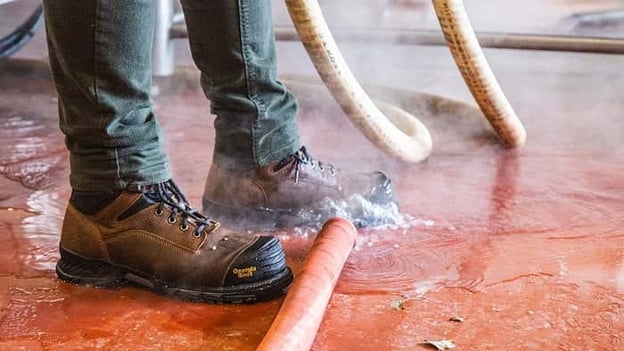 Closeup of Georgia Boots while brewer is standing in highwater