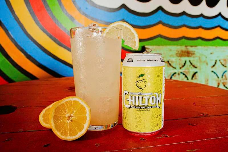 A can and glass of Blur Hard Seltzer flavor Chilton featuring real lemon puree from TUPPS Brewery