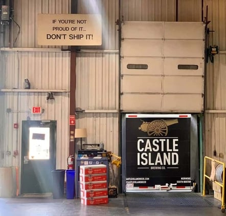Inside Castle Island Brewing Co. loading dock with delivery truck