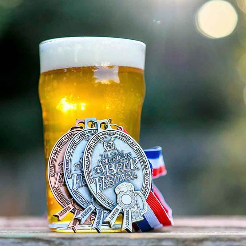 https://lounge.untappd.com/hs-fs/hubfs/close-up-of-beer-glass-with-medals-from-great-american-beer-festival.jpg?width=800&name=close-up-of-beer-glass-with-medals-from-great-american-beer-festival.jpg