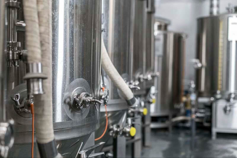 close-up-shot-of-brew-tanks-and-hoses