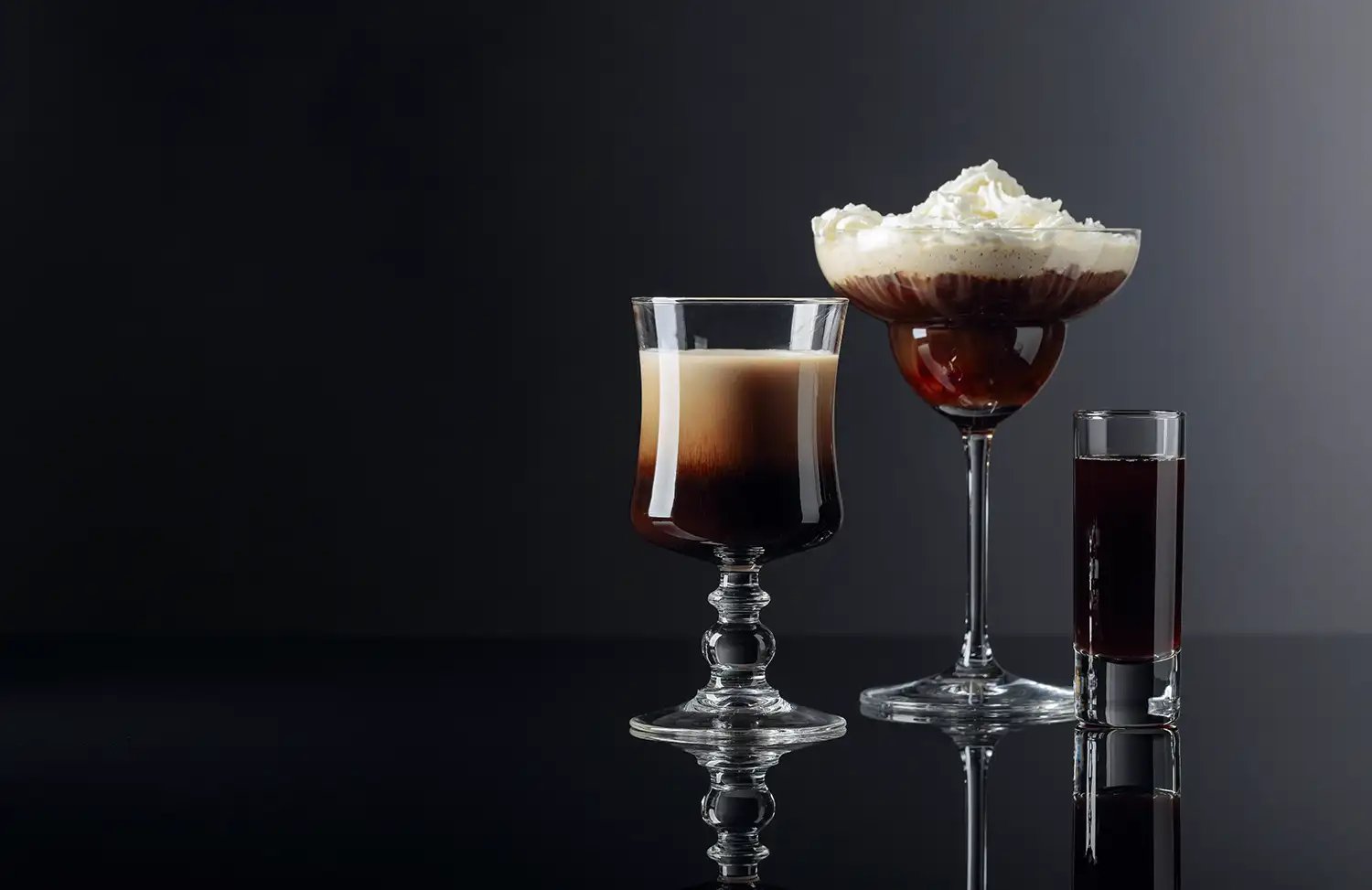A variety of coffee cocktails on dark setting