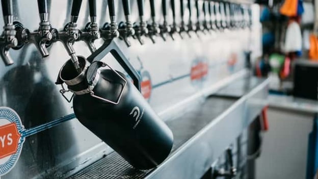 Filling a DrinkTanks crowler at a beer tap wall