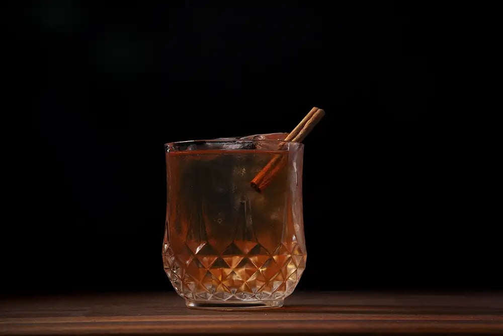 A cinnamon Fireball whiskey cocktail in a glass