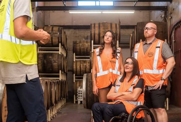 Group of friends touring a handicap and wheelchair friendly brewery