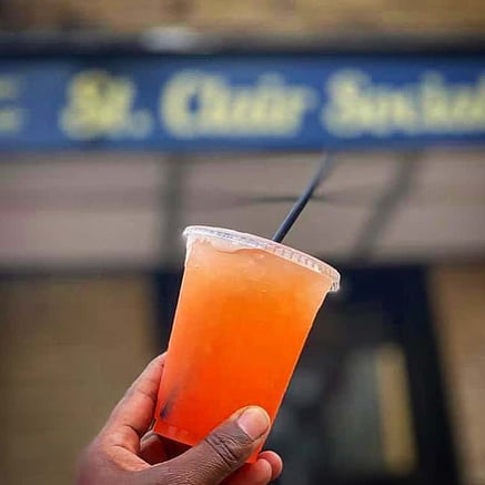 Holding a pre mixed cocktail or frozen drink at Mindful Hospitality Group