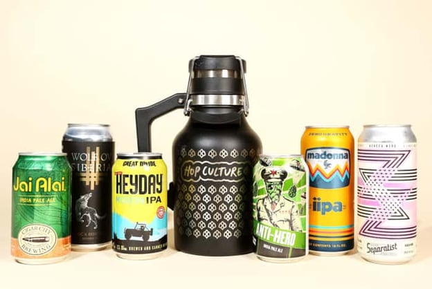 Hop Culture branded growler with a variety of craft beer cans
