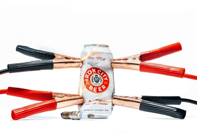 Iron City Beer can with jumper cables