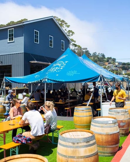 Outdoor seating and tents at Humble Sea Brewing Company