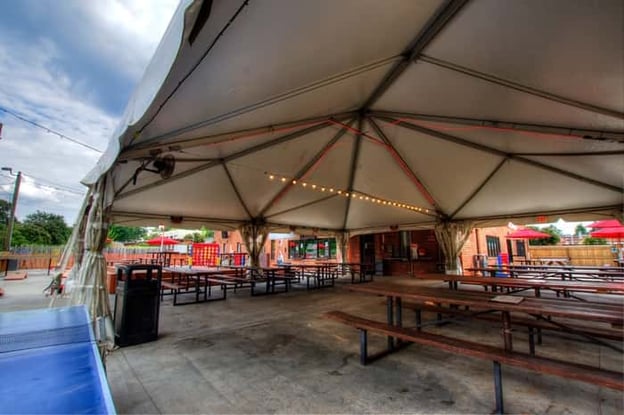 Outdoor tent with string lights at VBGB Beer Hall and Garden