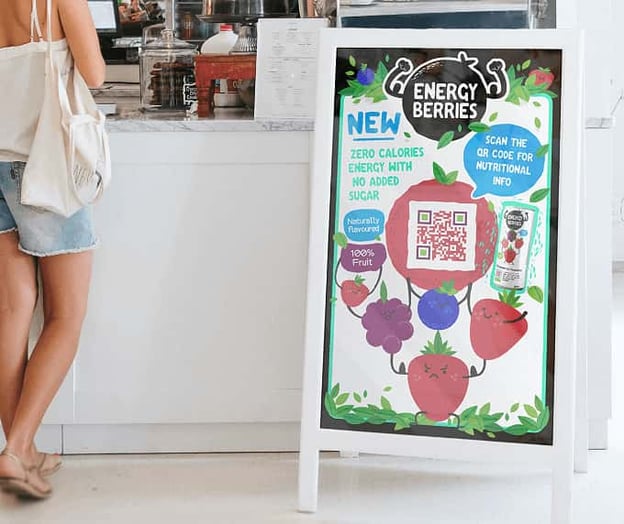 QR code on sandwich board outside of smoothie shop