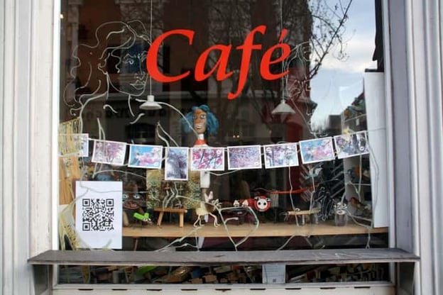 Creativey displayed QR codes in a cafe window