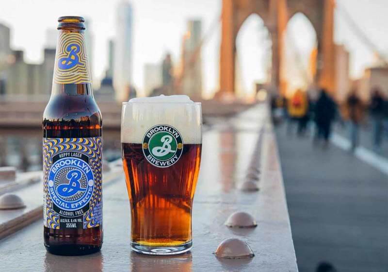 Brooklyn Brewery's non-alcoholic beer, Special Effects in a photo with a bottle and glass on the Brooklyn Bridge