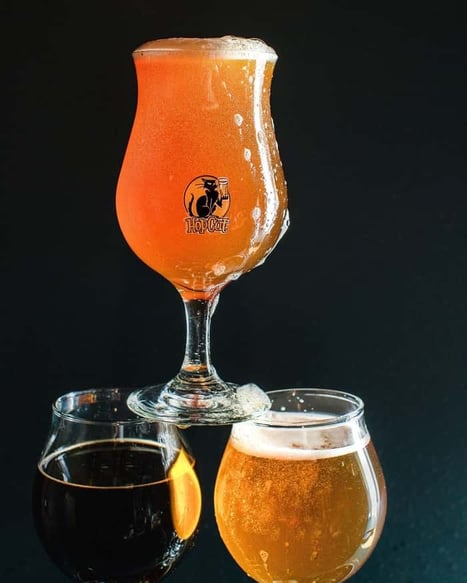 Various stacked beer glasses from HopCat