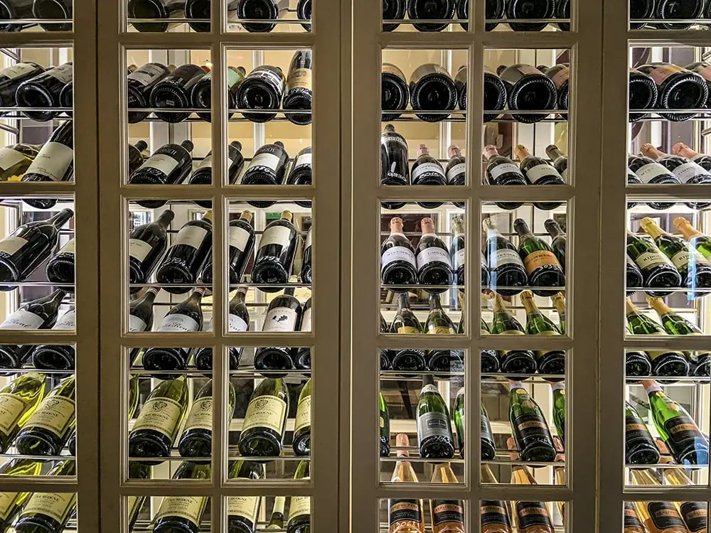 Wine bottles stored in a temperature controlled storage unit