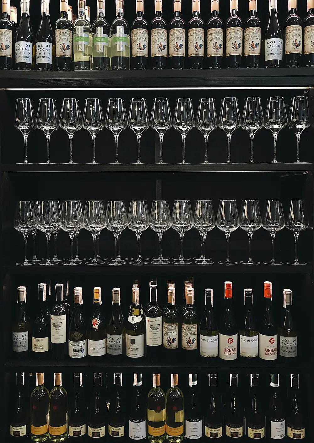 Wine organized within a display at a restaurant